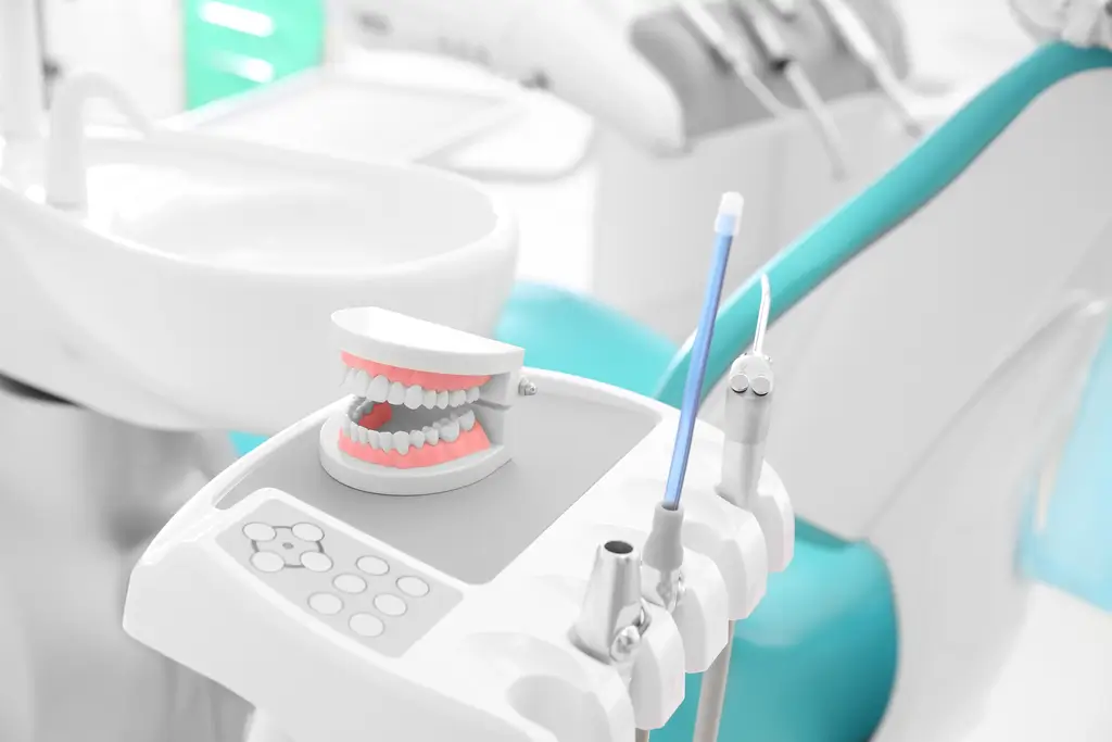 there is a toothbrush and a toothbrush holder in a dental room