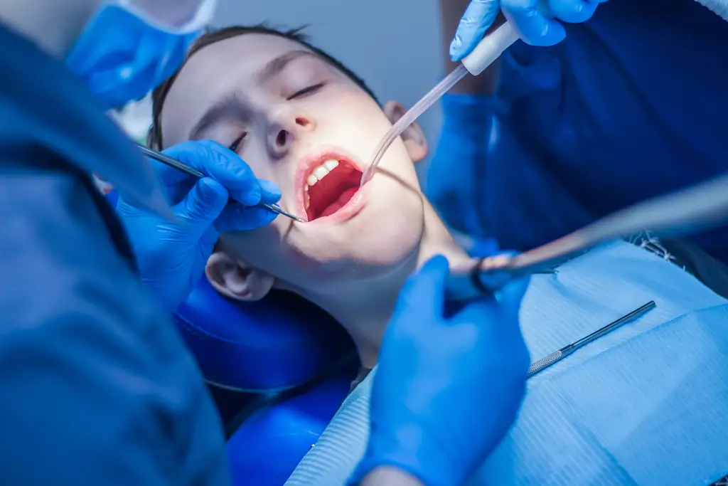 arafed child getting her teeth examined by a dentist